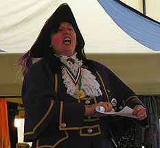 Female town crier in purple cape