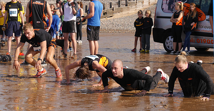 press-ups in the wet sand