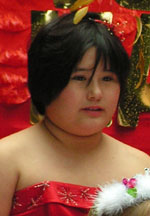 Carnival Queen's attendant in red dress