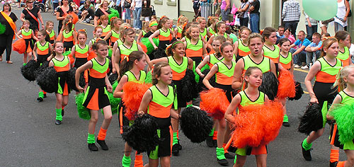 vivid green and orange dance costumes