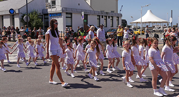 dancers in polka dots on Strand Street