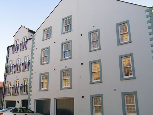 Garages beneath flats with Georgian windows