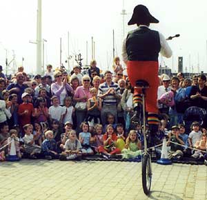 Captain Bullock unicycles and juggles