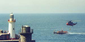 Naval Sea-King transfers to RNLI lifeboat