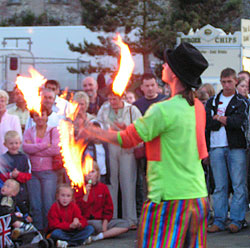 Juggling fire at night