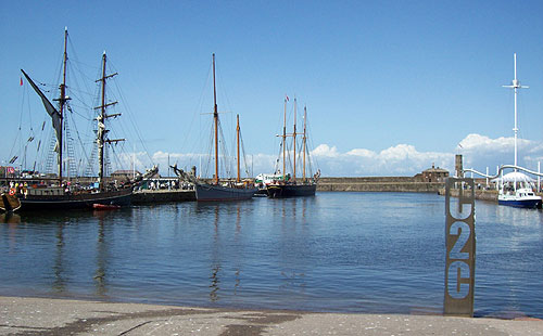 3 tall ships in Whitehaven harbour at the C2C start