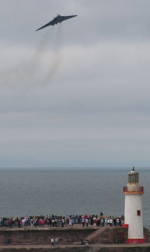 Vulcan approaches over Whitehaven's West Pier