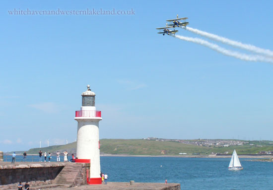 utterly butterly biplanes passing over west pier lighthouse