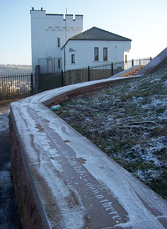 Inscription on Wall near candlestick monument