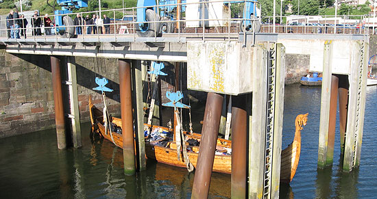 Viking ship lowered into the harbour