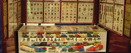 Collection of model cars and badges