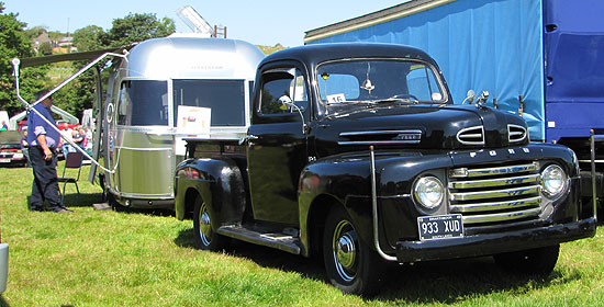 ford pickup with silver bullet trailer