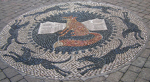 Pebble mosaic of fox and hounds