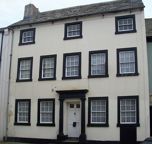 black and white house before renovation